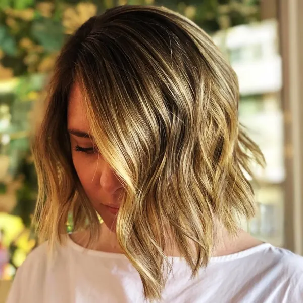 Golden balayage on a wavy bob
