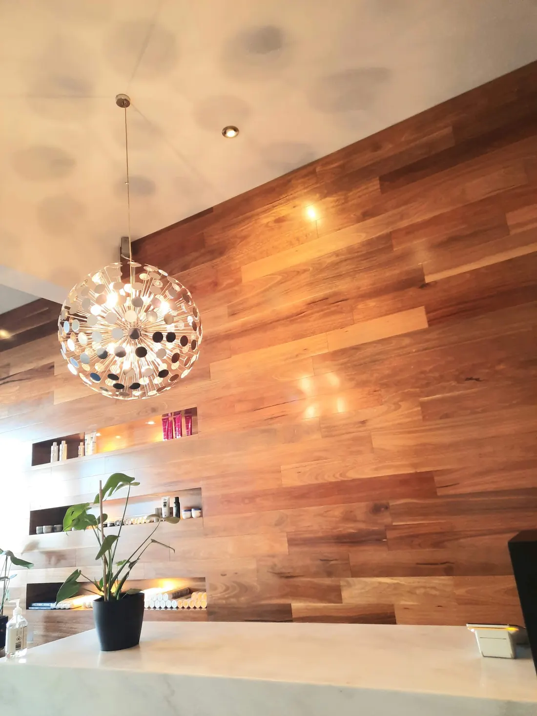 The timber feature wall and sparkle pendant light at Room 53